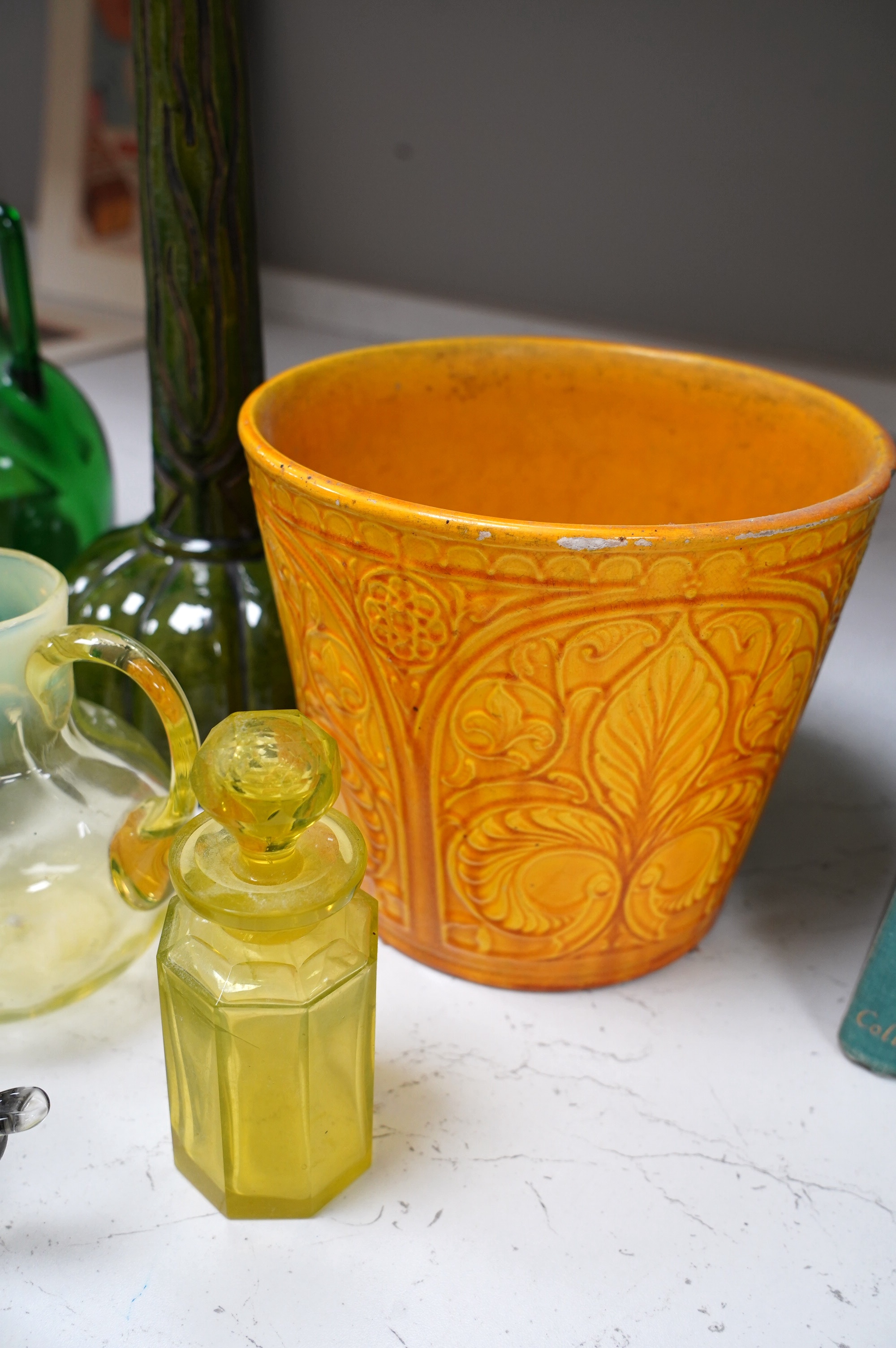 A collection of coloured glassware to include Vaseline examples and a collection of pottery to include a candlestick, a dish and a planter, largest 38cm (10). Condition - mostly fair